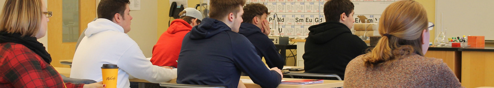 students in a chemistry classroom looking at the whiteboard